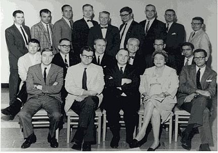 The original editors of the Iowa Works of Mark Twain. Front Row, left to right: Hennig Cohen, Warner Barnes, Walter Blair, Gladys C. Bellamy, Roger B. Salomon. Middle Row: Edwin Barber of Harper & Row, William B. Todd, Arlin Turner, William M. Gibson, Franklin R. Rogers, Allan C. Bates. Back Row: Howard G. Baetzhold, Hamlin L. Hill, James D. Williams, Louis J. Budd, John C. Gerber, Paul Baender, Edgar Marquess Branch, Albert E. Stone, and Frederick Anderson. Absent: Roger Asselineau, Leon T. Dickinson, Paul Fatout, and Lewis Leary. Date: 10 or 11 July 1964, Iowa City, Iowa.